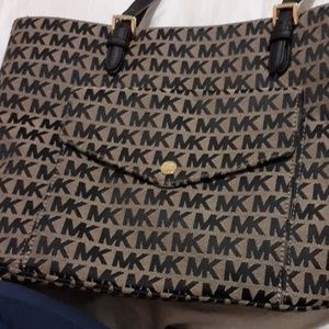 A brown and black MK bag